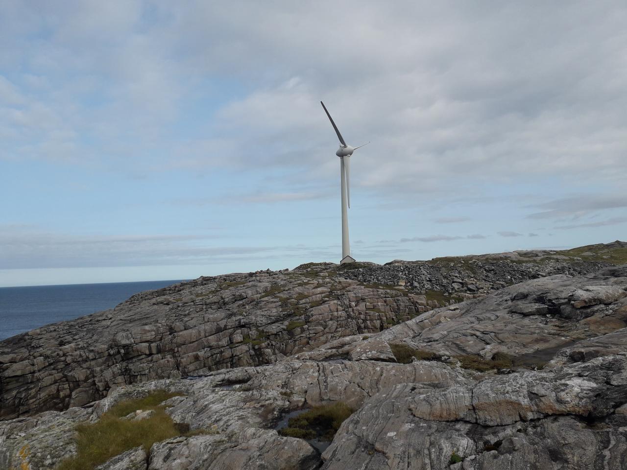 A wind turbine on rocks