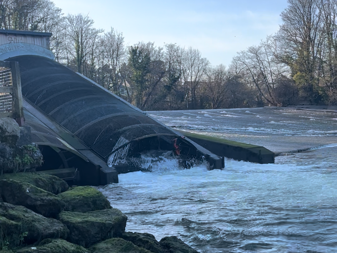 A hydro power station at the side of a river